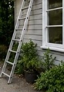Ladder set up for exterior maintenance work